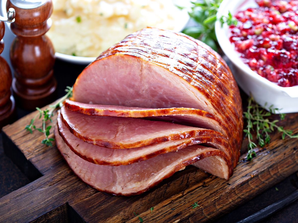 sliced ham on a cutting board.
