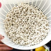 Great northern beans in a colander.