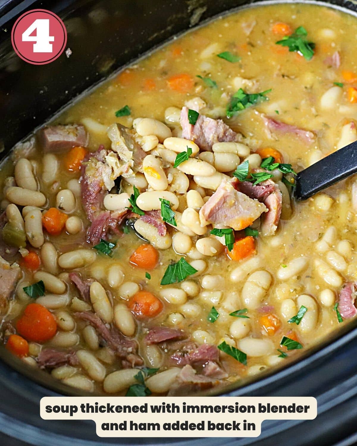 Ham and bean soup in a slow cooker with a ladle in it.