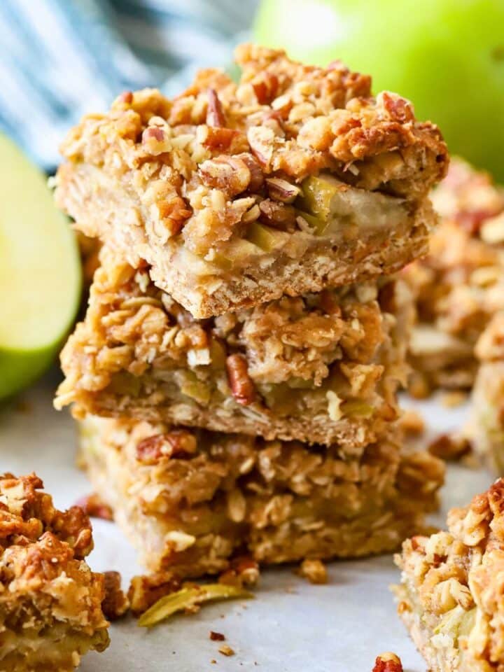 Three stacked baked apple oatmeal bars.