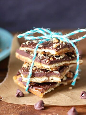 a stack of Christmas Crack tied with baker's twine.