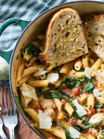 A pot full of chicken, spinach, and pasta!