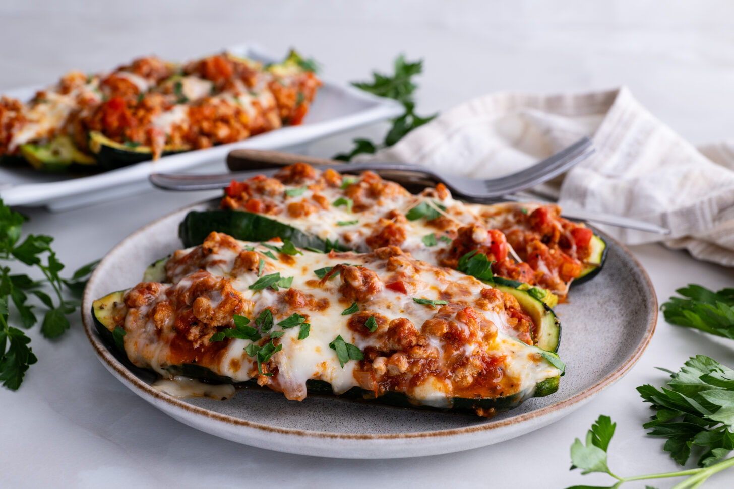 Side view of turkey stuffed zucchini boats
