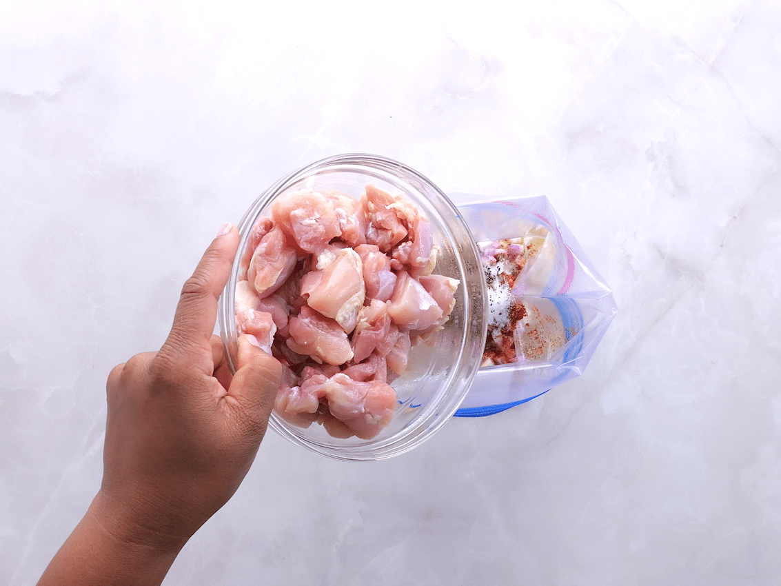 Marinating chicken for greek chicken bowls with tzatziki sauce