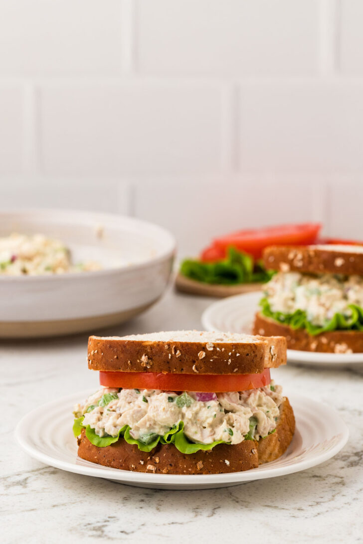 One chicken salad sandwich on a plate