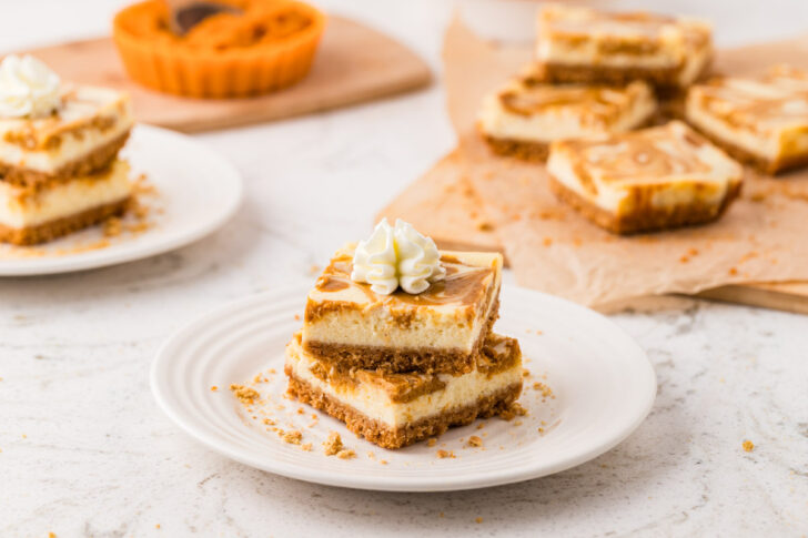 Pumpkin Cheesecake Bars with whipped cream