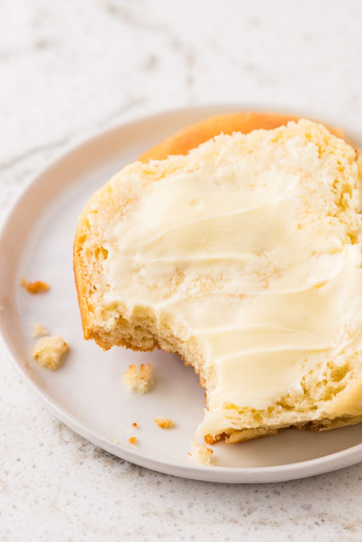 Yeast roll sliced in half and slathered in butter